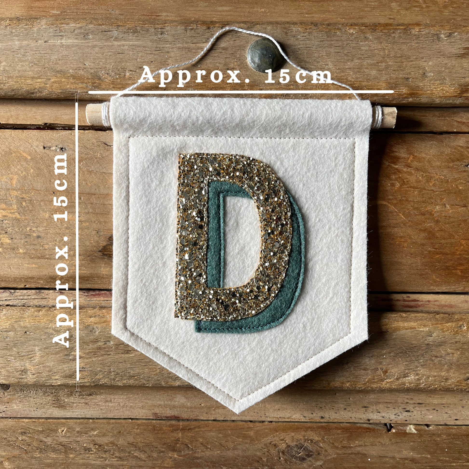 Cream felt initial banner with chunky gold glitter and dark teal drop shadow effect perfect for kids room decor including measurements 