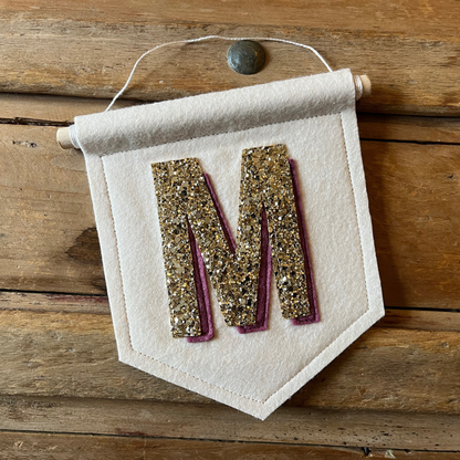 Cream felt initial banner with chunky gold glitter and Mulberry drop shadow effect perfect for kids room decor