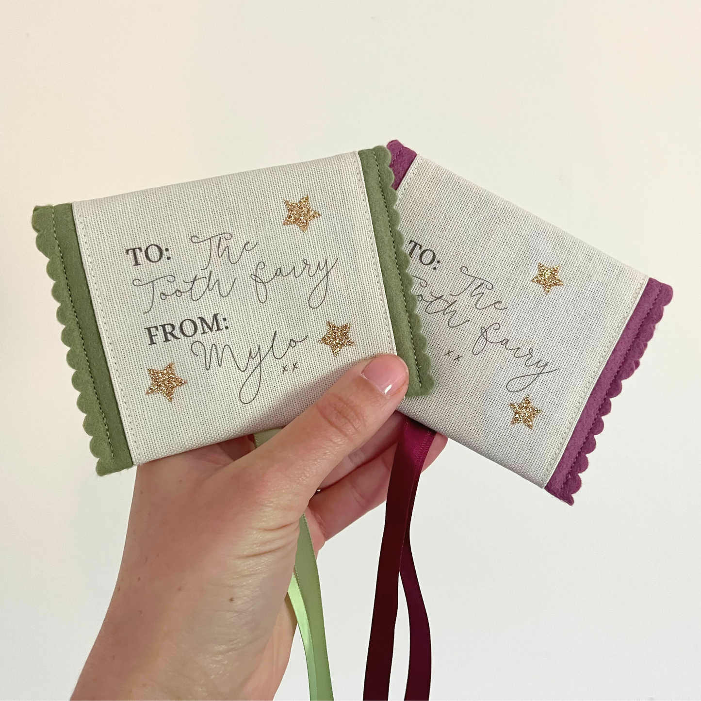 Decorative tooth fairy pouch with personalised text and star designs in multiple colours 