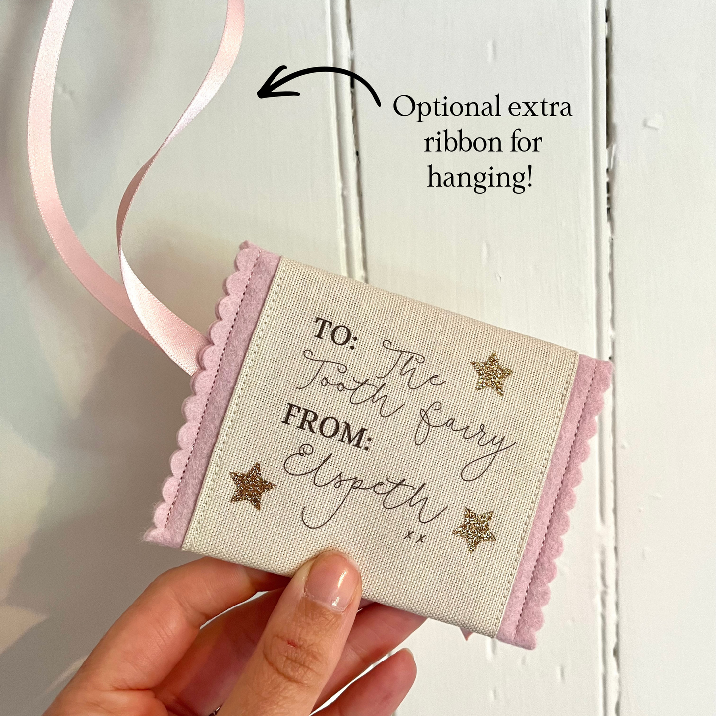 Decorative tooth fairy pouch with personalised text and star designs with extra ribbon loop for hanging