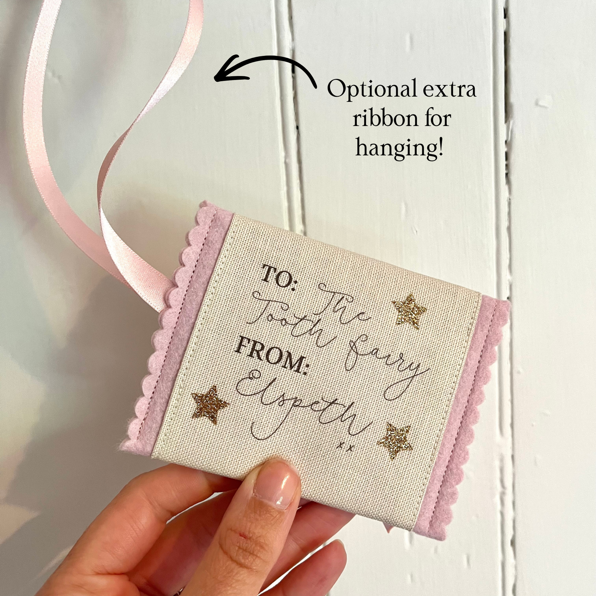 Decorative tooth fairy pouch with personalised text and star designs with extra ribbon loop for hanging