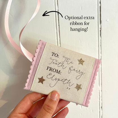Decorative tooth fairy pouch with personalised text and star designs with extra ribbon loop for hanging